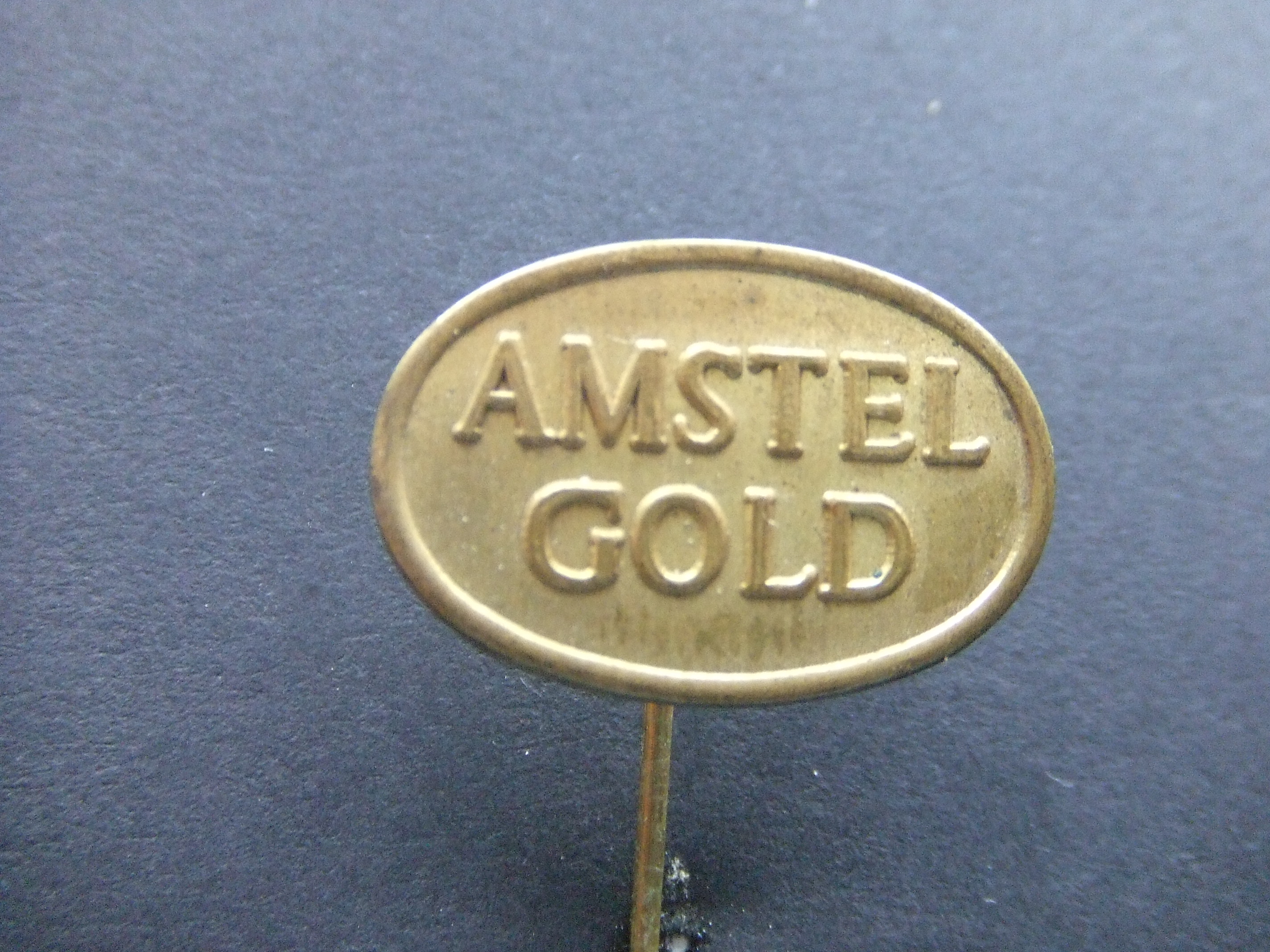 Amstel gold bier, goudkleurig logo